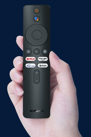 Compact voice remote held in a hand